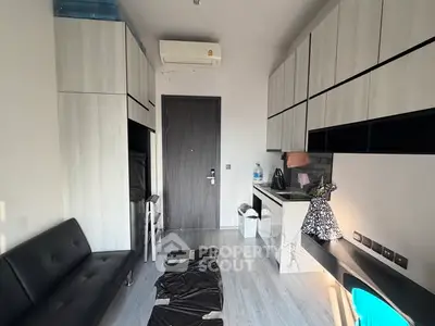 Modern compact living room with sleek cabinetry and minimalist design