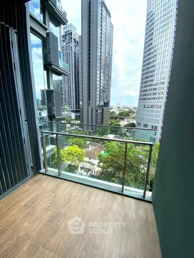 Modern balcony with city skyline view and sleek glass railing