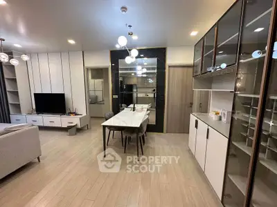 Modern open-plan living room with sleek furniture and stylish lighting