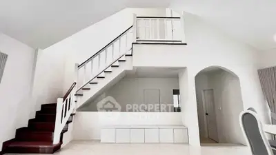 Spacious modern interior with elegant staircase and minimalist design