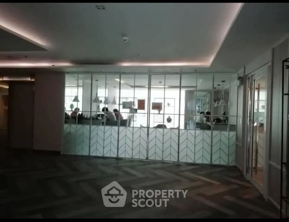 Modern office space with glass partitions and stylish flooring