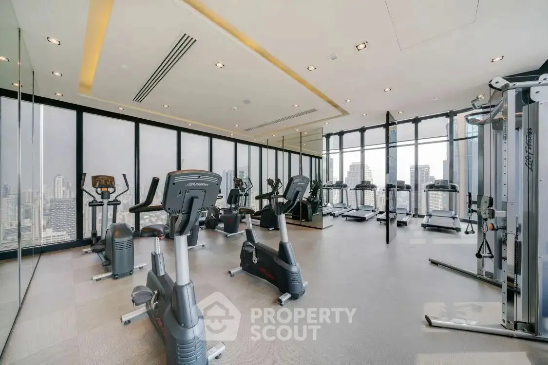 Modern gym with state-of-the-art fitness equipment and bright lighting.