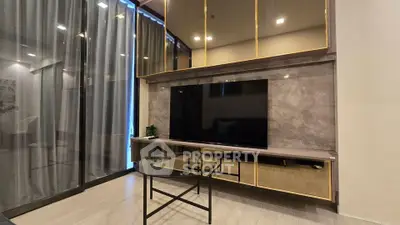 Modern living room with sleek TV unit and glass coffee table, featuring floor-to-ceiling windows and elegant decor.