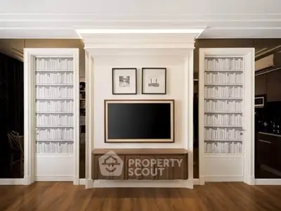 Elegant living room with built-in bookshelves and modern decor