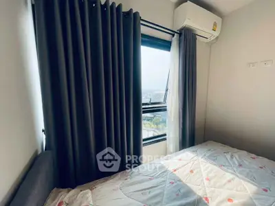 Cozy bedroom with window view and air conditioning unit