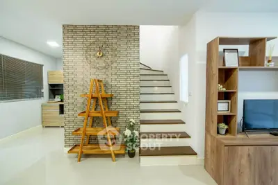 Modern living room with stylish staircase and wooden shelving unit