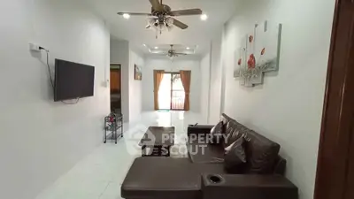 Spacious living room with modern decor and comfortable seating