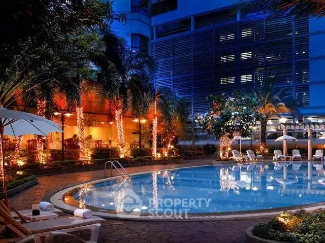 Luxurious poolside view with ambient lighting and modern architecture