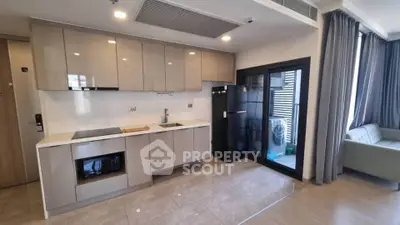 Modern kitchen with sleek cabinetry and open layout in a stylish apartment