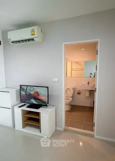 Modern apartment interior with air conditioning and bathroom view