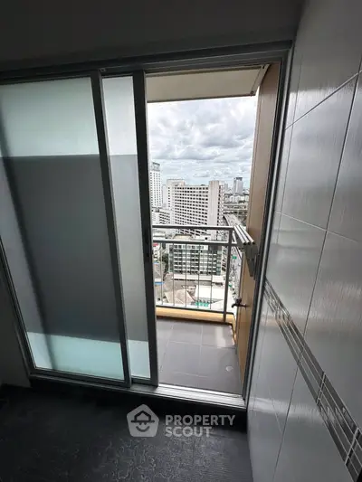 Modern balcony with city view from high-rise apartment