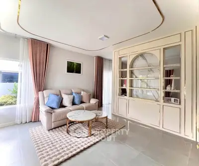 Elegant living room with stylish furniture and large windows, perfect for modern living.