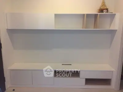 Modern minimalist white storage unit with open shelves and cabinets