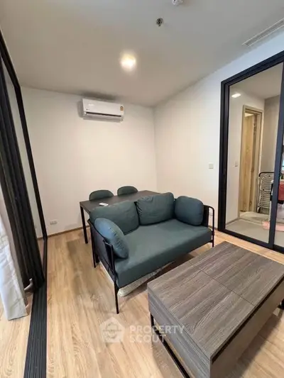Modern living room with stylish furniture and air conditioning in a cozy apartment.