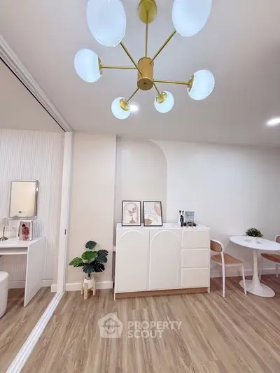 Modern living room with elegant chandelier and stylish decor