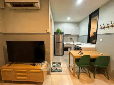 Modern apartment interior with cozy living area and compact kitchen.