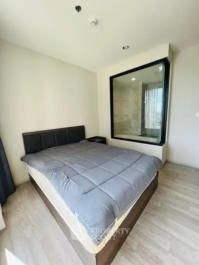 Modern bedroom with large window and stylish decor