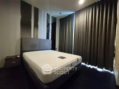 Spacious bedroom with modern design and large windows for natural light