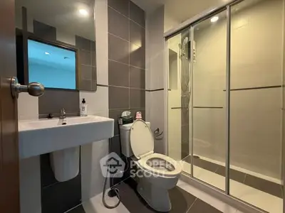 Modern bathroom with sleek design and glass shower enclosure