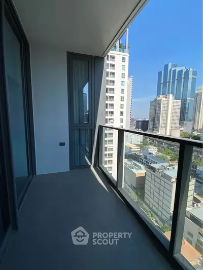 Modern high-rise balcony with city skyline view, perfect for urban living.