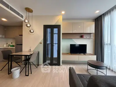 Modern living room with stylish furniture and large windows in a contemporary apartment.