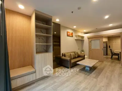 Spacious modern living room with stylish wooden accents and cozy seating area.