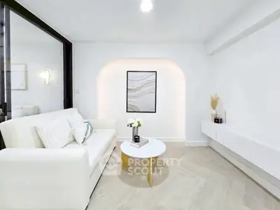 Elegant modern living room with white sofa and minimalist decor