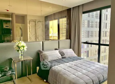 Modern bedroom with city view and elegant decor in high-rise apartment