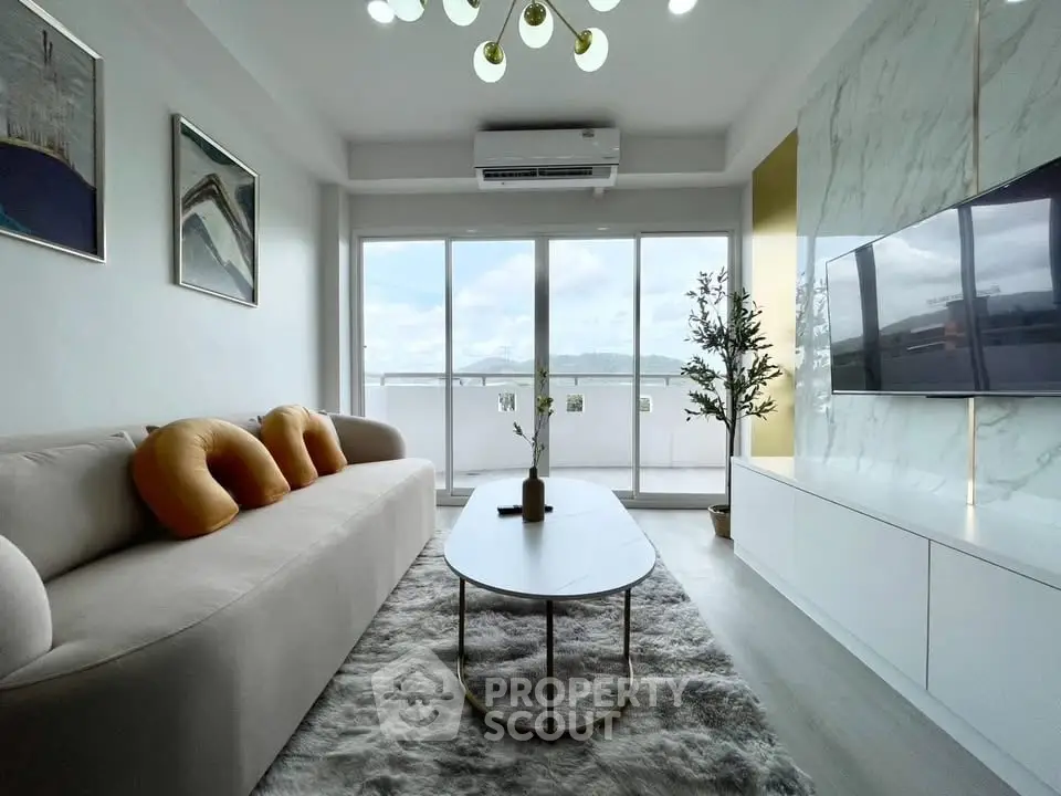 Modern living room with elegant decor and large windows offering stunning views.