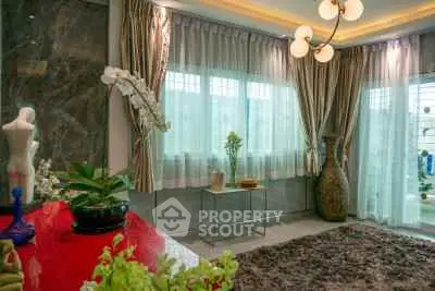 Luxurious living room with elegant decor and large windows