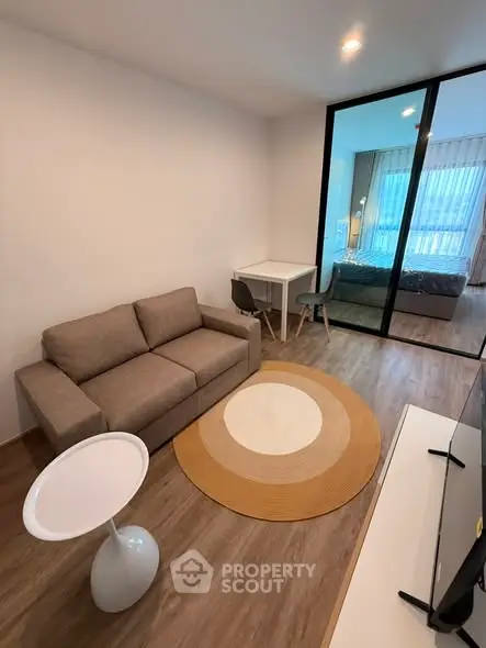 Modern studio apartment with cozy living area and stylish bedroom