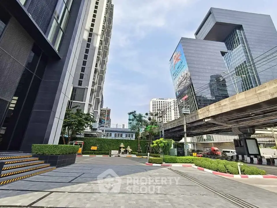Modern urban building exterior with sleek architecture and cityscape view.
