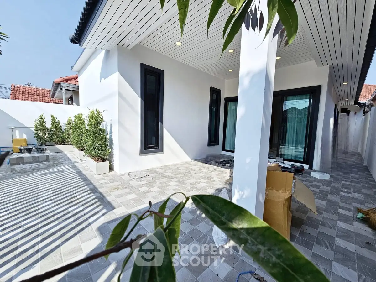 Modern home exterior with spacious patio and sleek design