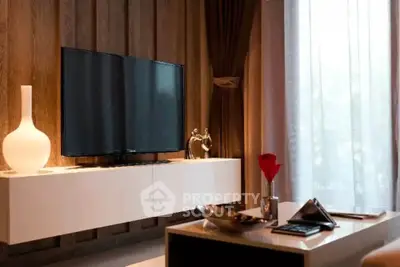 Modern living room with stylish decor and large TV, featuring elegant curtains and ambient lighting.