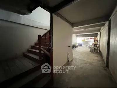 Spacious unfinished basement with potential for renovation and customization.