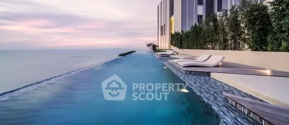 Luxurious infinity pool with ocean view at modern high-rise building