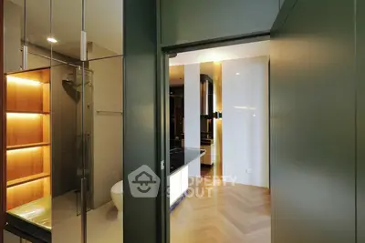 Modern apartment interior with sleek bathroom and open hallway