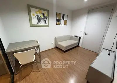 Cozy modern living room with wooden flooring and minimalist furniture