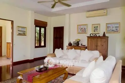 Spacious living room with elegant decor and comfortable seating in a stylish home.