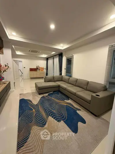 Spacious modern living room with stylish sectional sofa and elegant decor