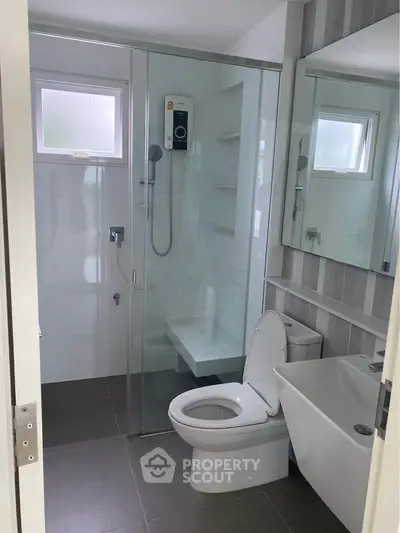 Modern bathroom with glass shower and sleek fixtures