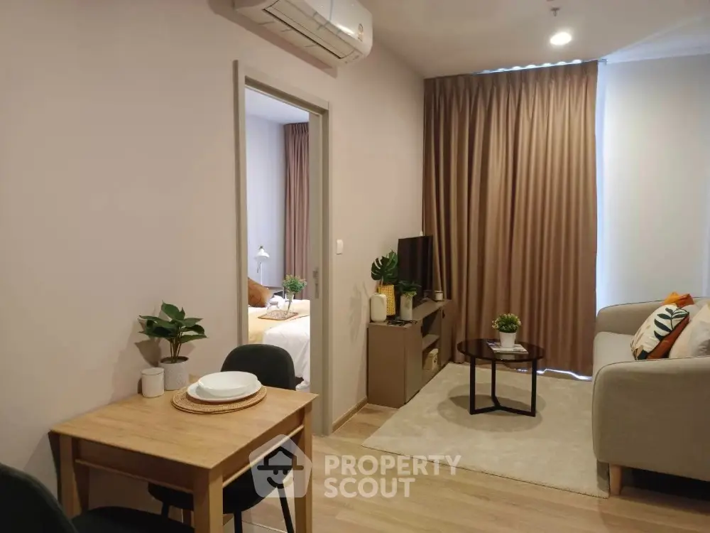 Cozy living room with modern decor and dining area in stylish apartment