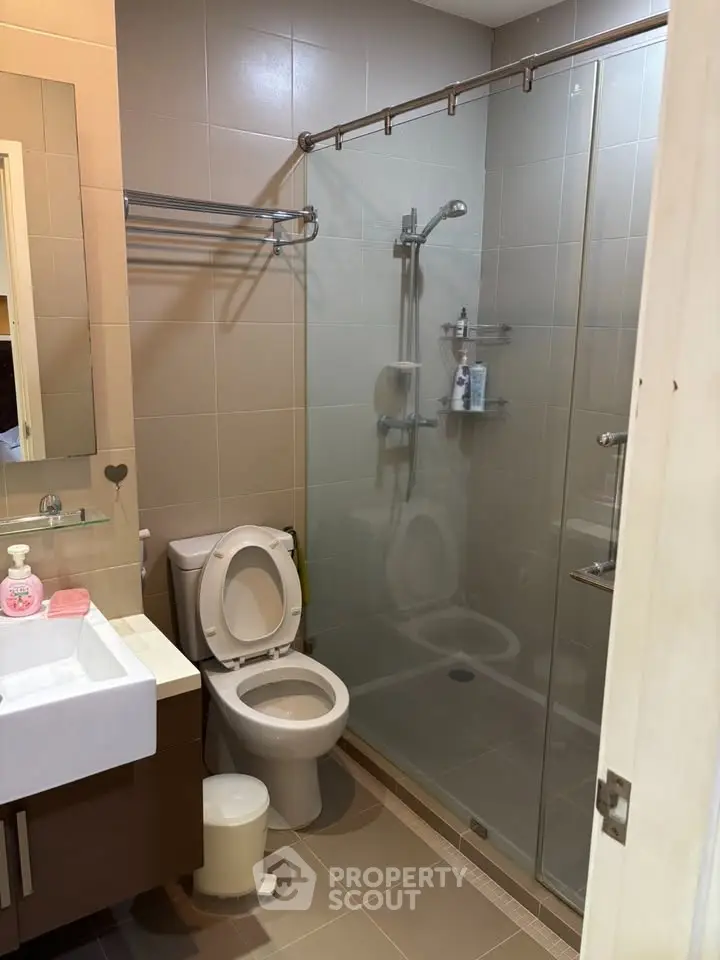 Modern bathroom with glass shower and sleek fixtures