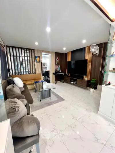 Spacious modern living room with sleek design and comfortable seating