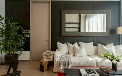 Stylish living room with modern decor and large mirror