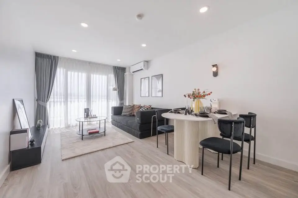 Spacious modern living room with elegant decor and abundant natural light