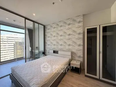 Modern bedroom with balcony view in high-rise apartment