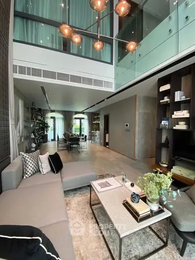 Luxurious modern living room with high ceilings and elegant decor