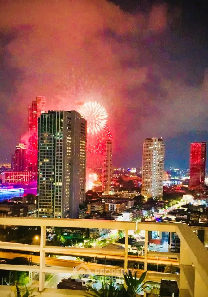 Stunning cityscape view with vibrant fireworks illuminating the night sky, perfect for urban living enthusiasts.