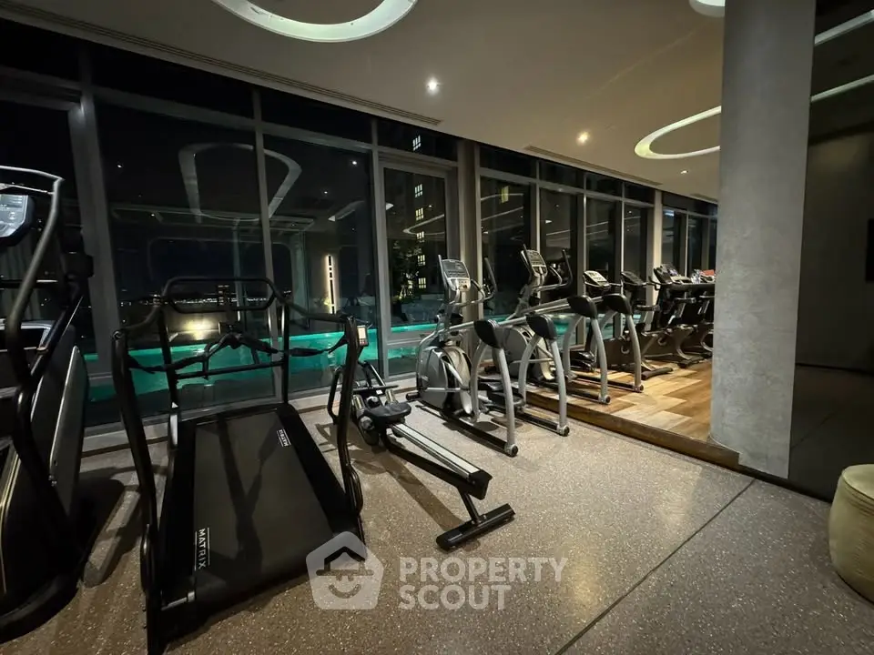 Luxurious gym with modern equipment and stunning night view